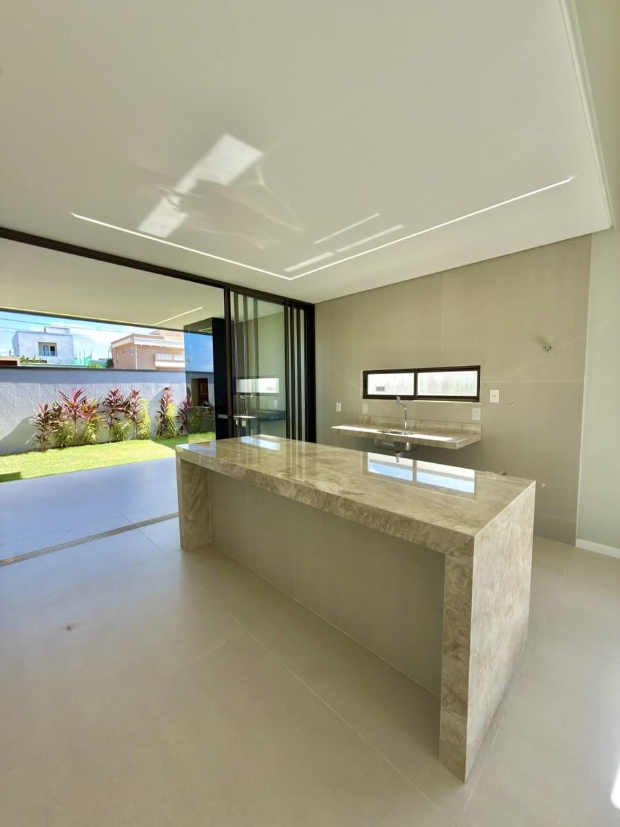 Cozinha com ilha em quartzito Perla Santana